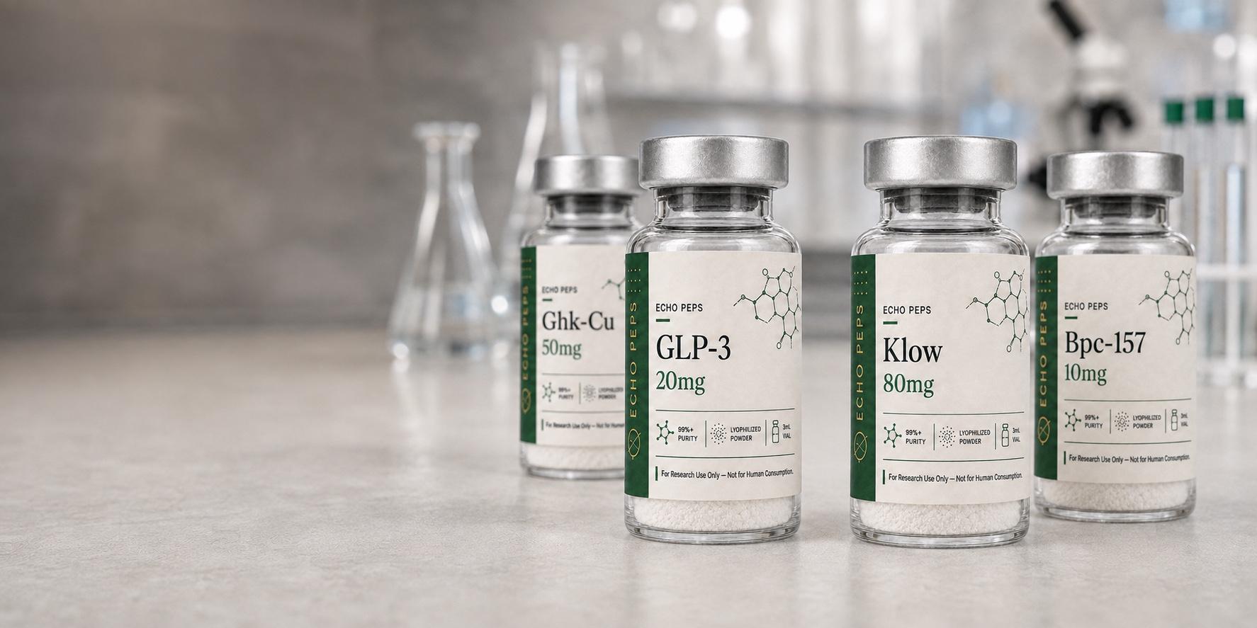 Echo Peps GHK-Cu, GLP-3, KLOW and BPC-157 vials on a laboratory bench